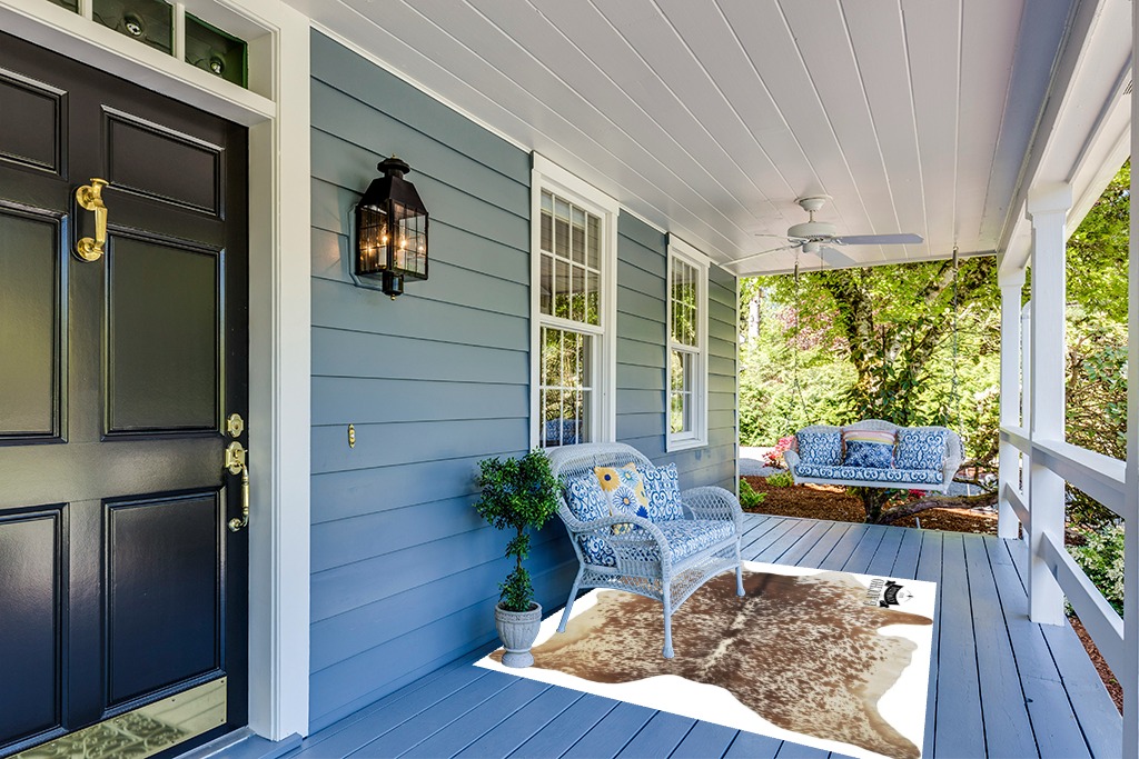 Gaucho Cowhides Natural Snowie Brown and White in Light Blue Patio