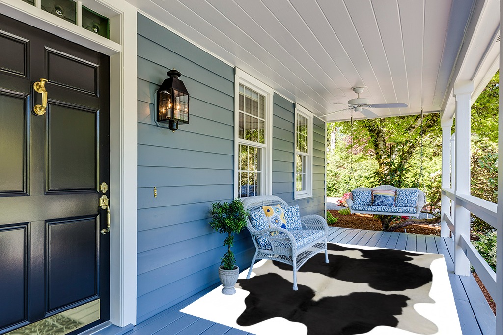 rodeo Classic Black and White Cowhide Rug … in Light Blue Patio