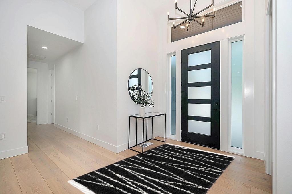 Abrahams Geometric Black/White Area Rug Hashtag Home Rug Size: Rectangle 5'3" x 8' in Modern White Entryway
