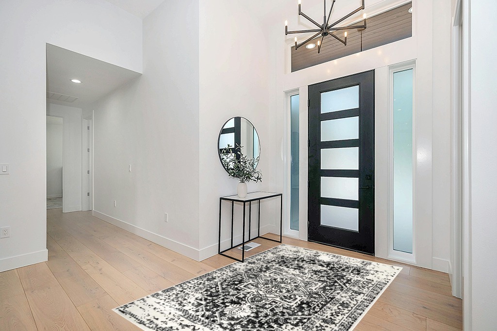 nuLOOM Jordana Vintage Distressed Medallion Area Rug, 5x8, Black and White in Modern White Entryway