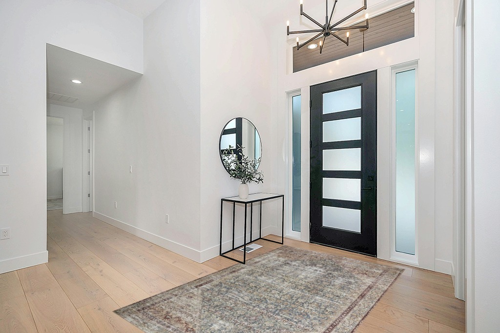 Loloi Amber Lewis x Loloi Georgie Collection GER-04 Teal/Antique 5'-0" x 7'-6" Area Rug in Modern White Entryway