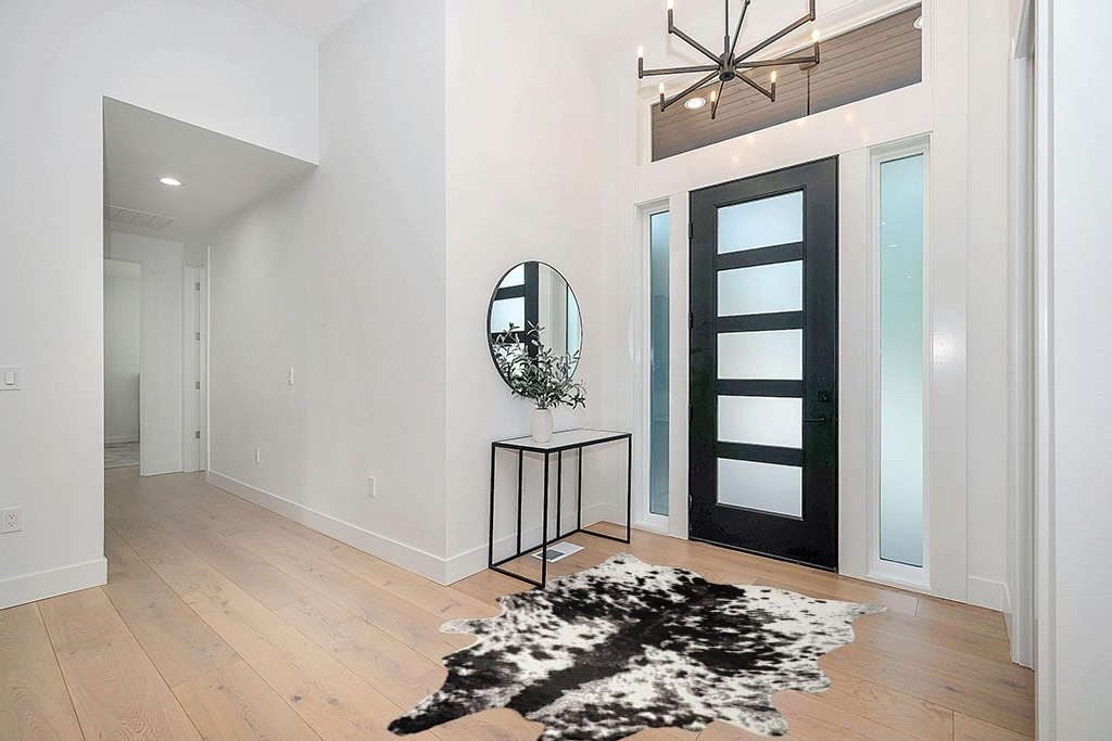 Yincimar Faux Cowhide Rug Extra Large Cow Print Area Rug 5.2ft x 6.6ft Non-Slip Animal Hide Carpet for Bedroom Living Room Western Home Office Decor (Black/Grey/White) in Modern White Entryway