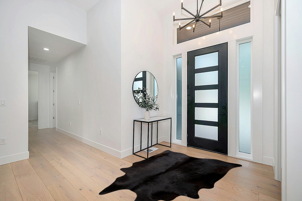 rodeo Solid Black Cowhide Rug (5x7) in Modern White Entryway