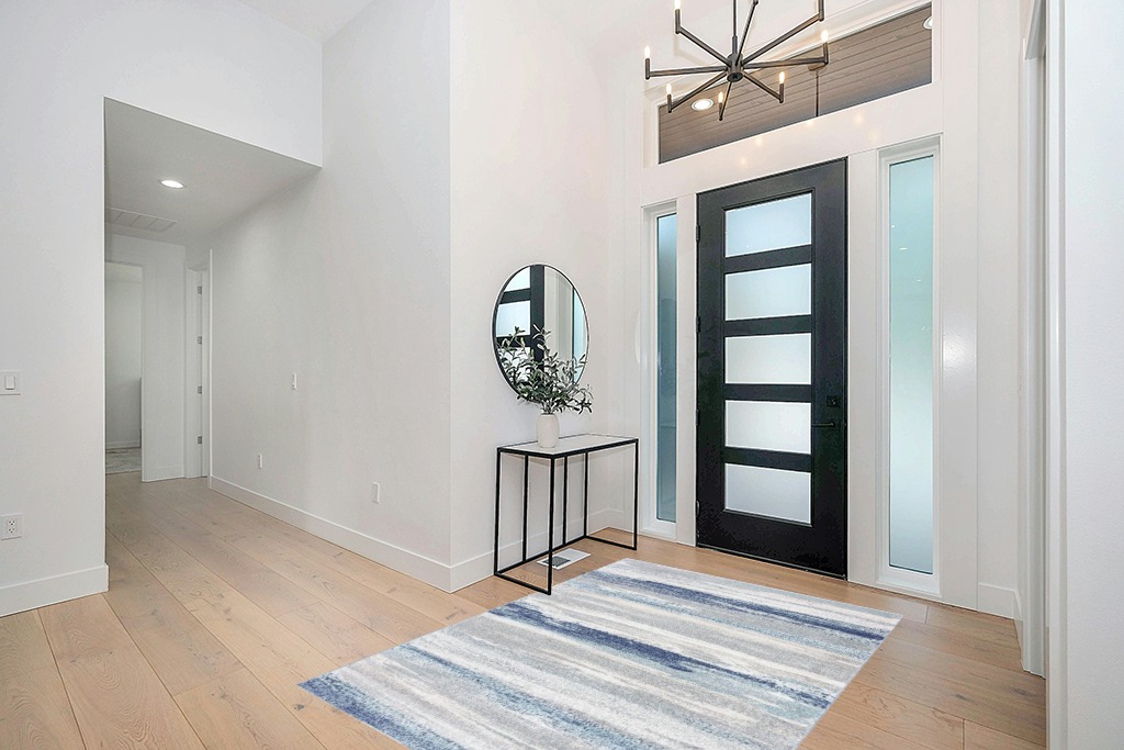 LUXE WEAVERS Tower Hill Abstract Blue 5x7 Area Rug in Modern White Entryway