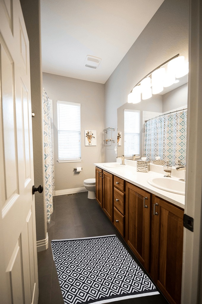 Small Black White Cotton Rag Rug in Wooden and Grey Bathroom