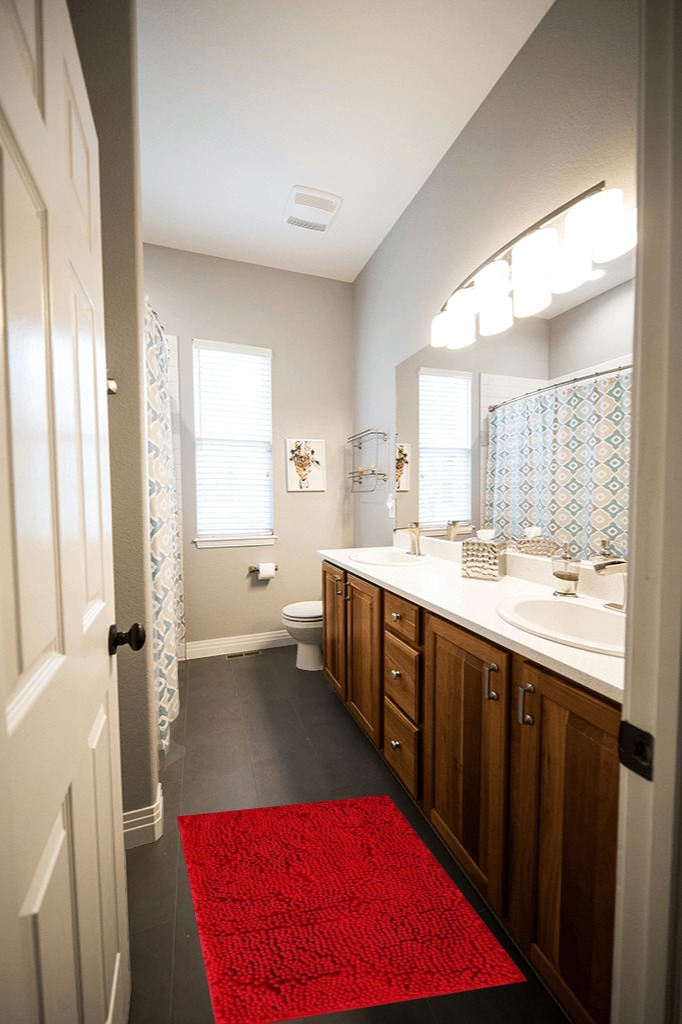 BOANKODU Bathroom Rugs Sets 2 Piece, Extra Soft Chenille Bath Mat Absorbent Bathroom Rug, Bathroom Mat with Sturdy PVC Non-Slip Bottom, Machine Washable Bath Rugs (32x20 Inch + 24x16 Inch, Red) in Wooden and Grey Bathroom