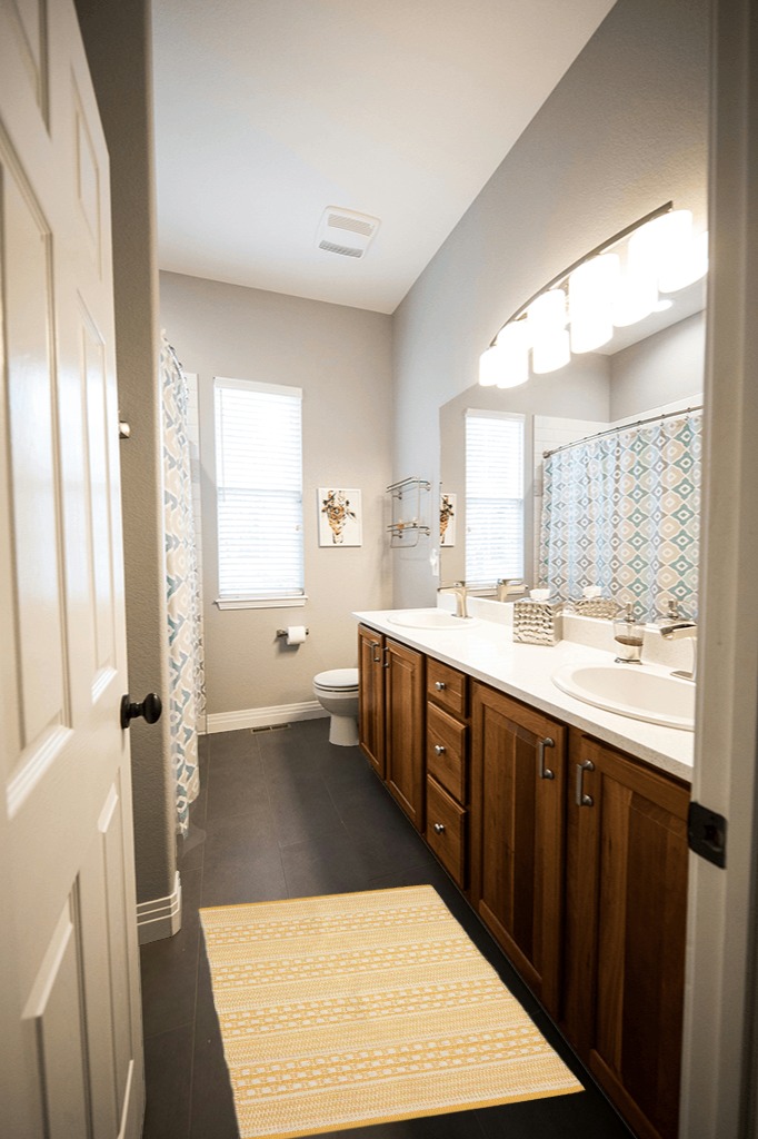 DII Woven Rugs Collection Hand-Loomed, 2x3', Honey Gold Dobby Stripe in Wooden and Grey Bathroom