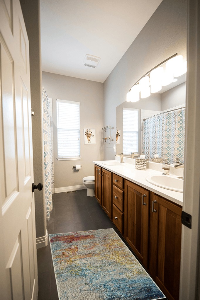 Nourison Celestial Modern Abstract Sealife 2'2" x 3'9" Area Rug in Wooden and Grey Bathroom