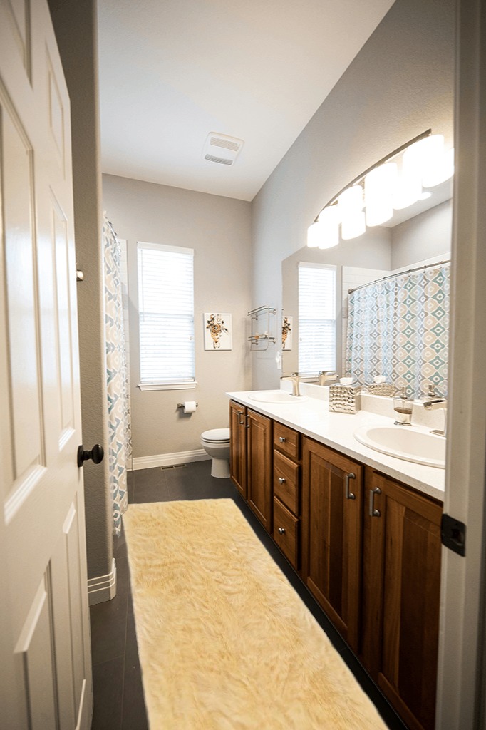 Latepis Faux Sheepskin Fur Furry Pale Yellow 2 ft. x 8 ft. Shaggy Fluffy Area Rug ... in Wooden and Grey Bathroom
