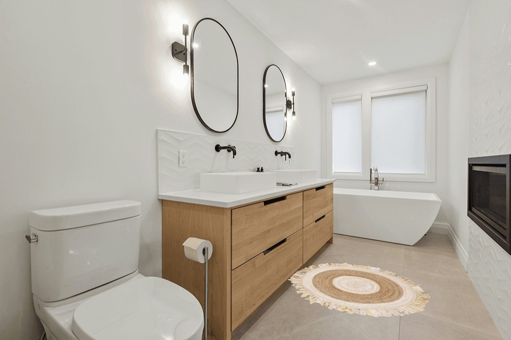 Highland Dunes Jaziel Handwoven Beige/Natural Area Rug, Size: Round 4' in Scandinavian Neutral bathroom