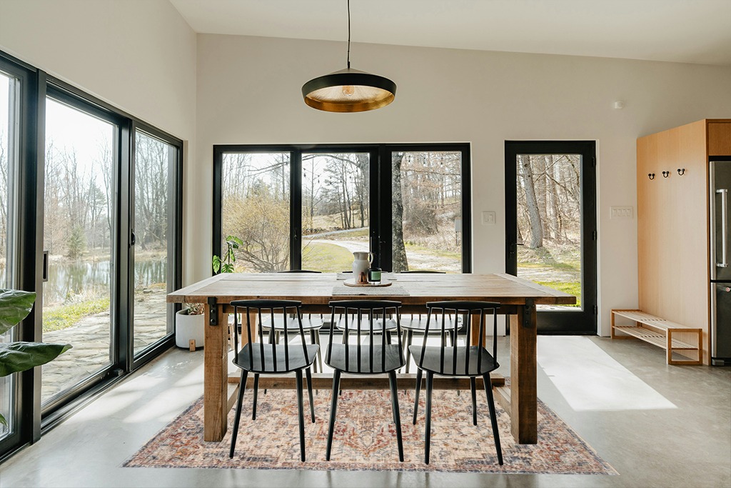 Loloi II Sorrento Collection SOR-05 Ivory/Fiesta 5'-3" x 7'-6" Area Rug in Scandinavian Dining Room with Rectangular Table