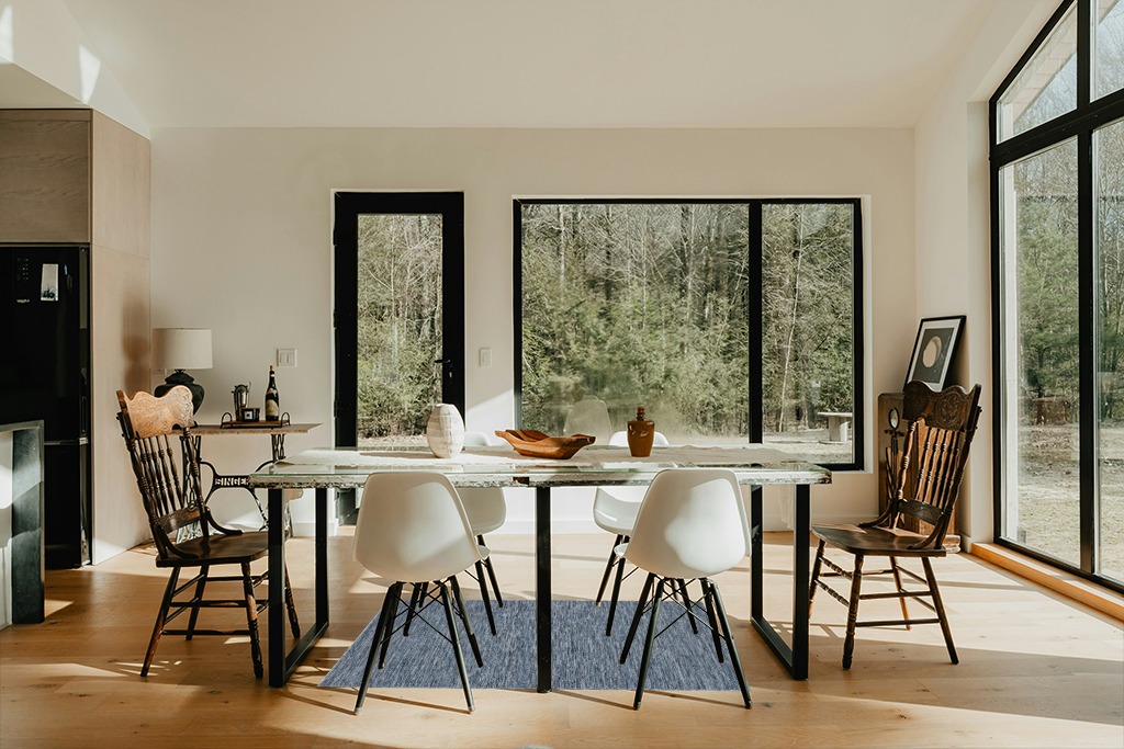 Nourison Practical Solutions Indoor/Outdoor Navy Blue 3' x 5' Area Rug, Easy Cleaning, Non Shedding, Bed Room, Living Room, Dining Room, Deck, Backyard, Patio (3x5) in Modern Scandinavian Dining Room with Black Accents