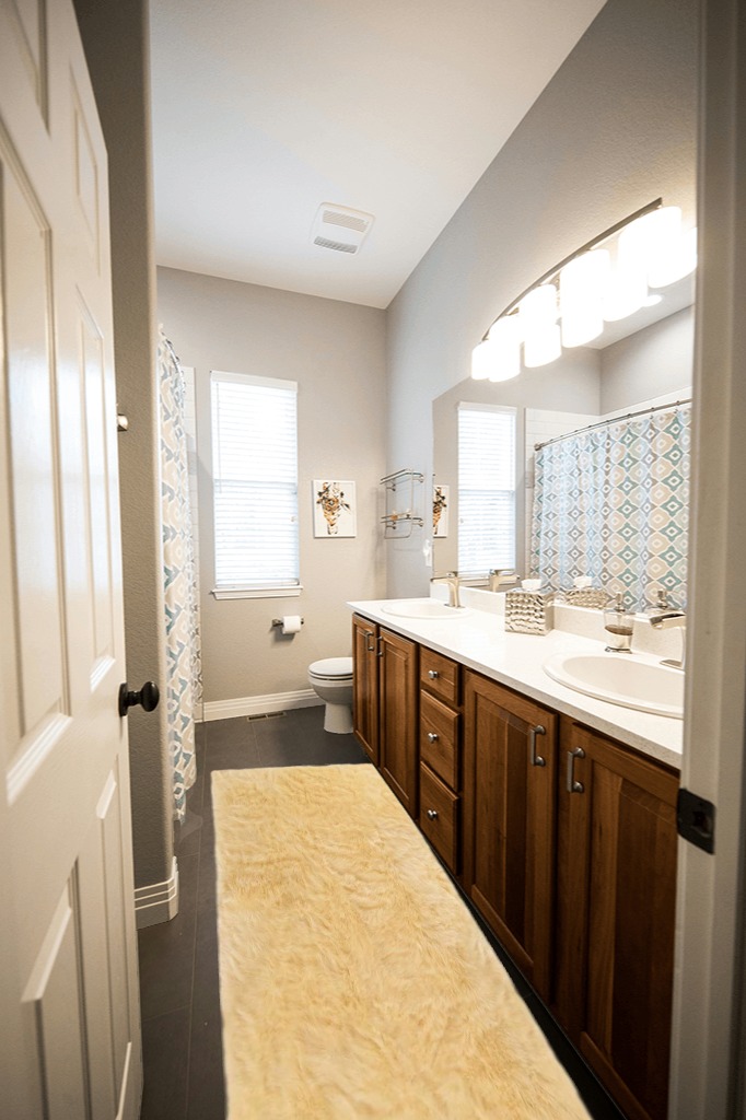 Latepis Faux Sheepskin Fur Furry Pale Yellow 2 ft. x 8 ft. Shaggy Fluffy Area Rug ... in Wooden and Grey Bathroom