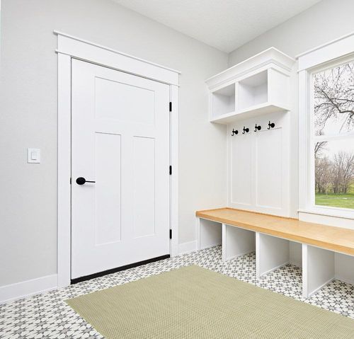 HomeRoots 5' X 7' Green Geometric Power Loom Area Rug in White Modern Entryway