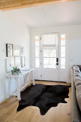 rodeo Solid Black Cowhide Rug (5x7) in White Scandinavian Entryway