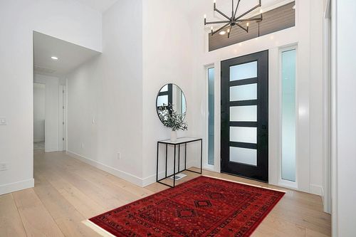 Unique Loom Tekke Collection Area Rug - Sheibani (5' 3" x 8' Rectangle, Red/ Black) in Modern White Entryway