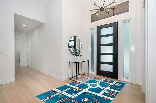 SAFAVIEH Carousel Kids Collection Area Rug - 5'3" x 7'6", Turquoise & Ivory, Non-Shedding & Easy Care, Ideal for High Traffic Areas for Boys & Girls in Playroom, Nursery, Bedroom (CRK192K) in Modern White Entryway