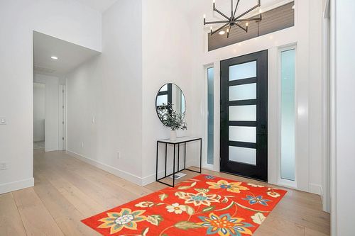 SAFAVIEH Blossom Collection 5' x 8' Rust / Multi BLM673A Handmade Premium Wool Area Rug in Modern White Entryway