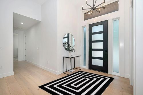 Lanffia Black and White Area Rug 5x7ft Contrasting Geometric Modern Stripe Symmetrical Indoor Outdoor Rug Machine Washable Extra Large Rugs Woven Cotton Floor Carpet for Living Room/Balcony/Backyard in Modern White Entryway