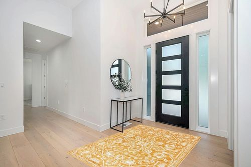 Well Woven Della Gold Vintage Medallion Pattern Area Rug (5'3" x 7'2") in Modern White Entryway