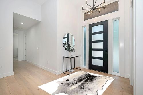 Cowhide Area Rug in Modern White Entryway