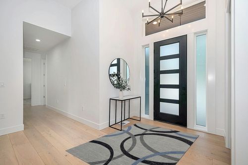 HomeRoots 5' X 7' Ivory Blue and Gray Geometric Area Rug in Modern White Entryway