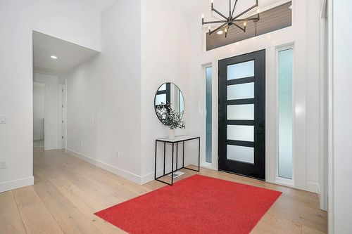 Garland Rug Skyline Shag 5 Ft. x 7 Ft. Area Rug Chili Red in Modern White Entryway