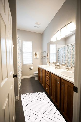 Black and White Moroccan Washable Bathroom Area Rug in Wooden and Grey Bathroom