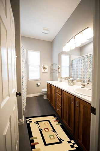 Ivy Bronx Mccampbell Beige Area Rug, Size: Rectangle 2' x 4' in Wooden and Grey Bathroom