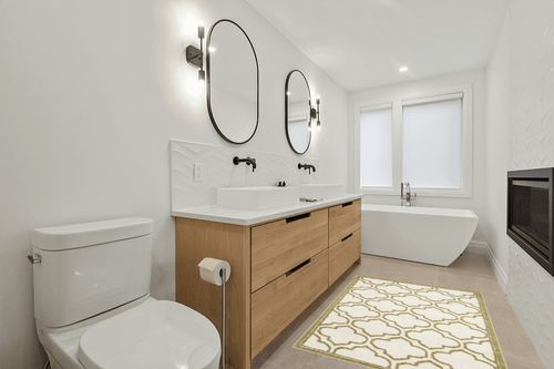 Ammundsen Geometric Ivory/Light Green Area Rug Lark Manor Rug Size: Rectangle 4' x 6' in Scandinavian Neutral bathroom