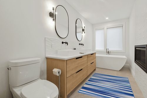 HomeRoots 4' X 6' Blue and White Striped Dhurrie Area Rug in Scandinavian Neutral bathroom