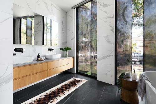 SAFAVIEH Studio Leather Collection 2'3" x 7' Ivory / Dark Brown STL215B Handmade Mid-Century Modern Leather Runner Rug in Modern Black Tiled bathroom