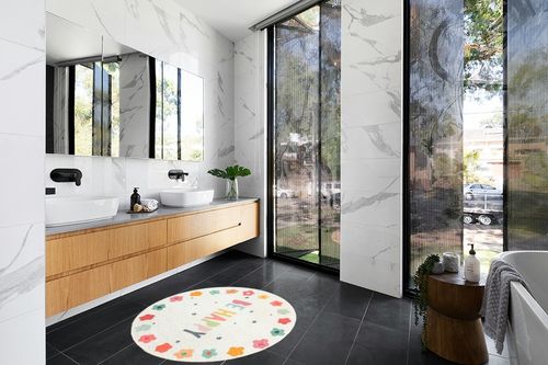 Poowe Round Kids Playroom Rug - Soft Alphabet Nursery Rug for Bedroom - Playtime Collection, Learning & Game Carpet for Classroom, Best Shower Gift for Infant Toddlers (Round 39.4", Flower-Happy) in Modern Black Tiled bathroom