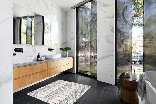 Julienne Geometric Ivory/Black Area Rug Foundstone Rug Size: Square 4'1" in Modern Black Tiled bathroom