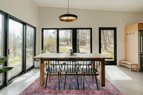 Safavieh Tucson Collection Area Rug - 8' Round, Rust & Blue, Traditional Persian Design, Non-Shedding Machine Washable & Slip Resistant Ideal for High Traffic Areas in Living Room, Bedroom (TSN153P) in Scandinavian Dining Room with Rectangular Table