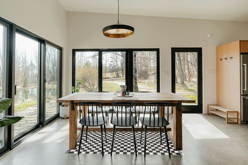 nuLOOM Pania Contemporary Checkered Fringe Area Rug, 4' x 6', Dark Gray in Scandinavian Dining Room with Rectangular Table