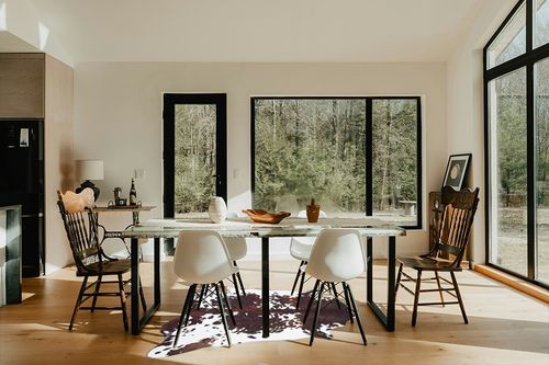 Guyi Rare Faux Cowhide Rug Large Cow Hide Rug 5.2X4.6 Feet Rustic Chic Western Rugs for Bedroom Living Room Dining Room Brown Animal Rugs Cow Print Non Slip Cow Area Rugs in Modern Scandinavian Dining Room with Black Accents