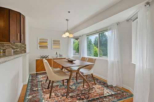 Moynesa Ultra-Thin Vintage Area Rug - 9x12 Large Living Room Rugs for Bedroom Aesthetic, Rugs for Under Dining Room Table, Oriental Medallion Printed Low Pile Carpet for Office Playroom Entryway Dorm in Modern White Dining Room with Wooden Accents