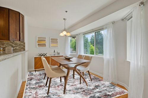 Miukiki 8x10 Area Rugs, Modern Abstract Washable Rug for Living Room, Stain Resistant Non-Shedding Distressed Area Rug with Non Slip Backing for Bedroom (Red/Grey, 8'x10') in Modern White Dining Room with Wooden Accents