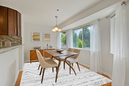 8x10 Large Moroccan Soft Fluffy Geometric Washable Bedroom Rugs in Modern White Dining Room with Wooden Accents
