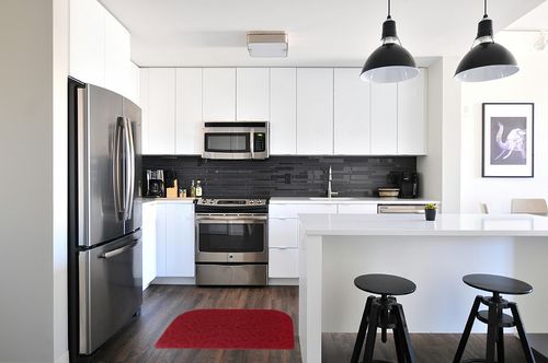 VANZAVANZU Kitchen Rug Mats, 30"x18" Non Slip Kitchen Mat Irregular Half Round Kitchen Carpet, Designed in Latex Backing Absorbent and Machine Washable for Kitchen Doorway Bathroom Floors (Red) in White and Black Modern Kitchen