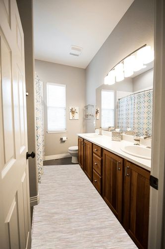 Artistic Weavers Halcyon Camel 2'7 inch x 10' Modern Solid Runner Rug in Wooden and Grey Bathroom