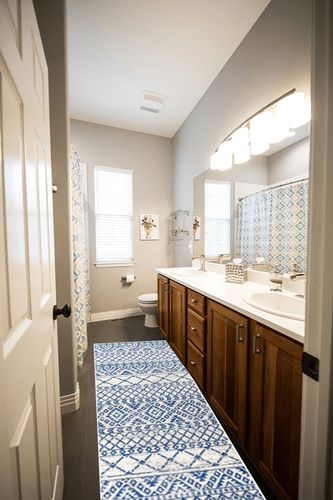 Moroccan Hype Boho Vintage Tribal Cream/Blue 2 ft. x 8 ft. Runner Rug in Wooden and Grey Bathroom