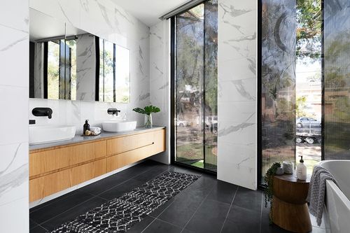 Moroccan Hype Boho Vintage Diamond Indoor Area-Rug in Modern Black Tiled bathroom
