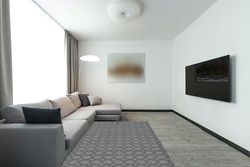 Garland Rug Garden Trellis 5 ft. x 7 ft. Indoor/Outdoor Area Rug Heather Gray in Modern Living Room with Grey Couch