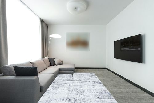 SAFAVIEH Amelia Collection Area Rug - 6' x 9', Ivory & Grey, Modern Abstract Design, Non-Shedding & Easy Care, Ideal for High Traffic Areas in Living Room, Bedroom (ALA700C) in Modern Living Room with Grey Couch