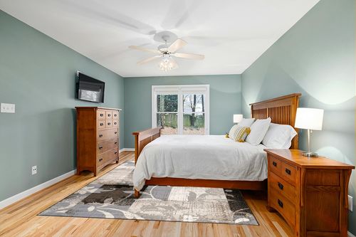 Indoor Area Rug with Jute Backing 8' X 10' in Teal and Orange Wood Bedroom
