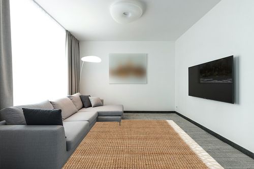 nuLOOM Raleigh Farmhouse Jute Tasseled Area Rug, 8x10, Natural in Modern Living Room with Grey Couch