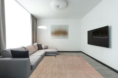 JONATHAN Y SEU100G-8 Haze Solid Low-Pile Indoor Area-Rug Casual Contemporary Solid Traditional Easy-Cleaning Bedroom Kitchen Living Room Non Shedding, 8 ft x 10 ft, Beige in Modern Living Room with Grey Couch