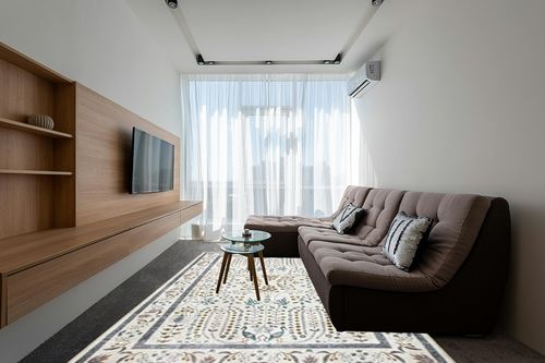 Loloi Rifle Paper Co. x Maison Wisteria Cream 8'-4" x 11'-6" Area Rug in Grey Living Room with Brown Couch